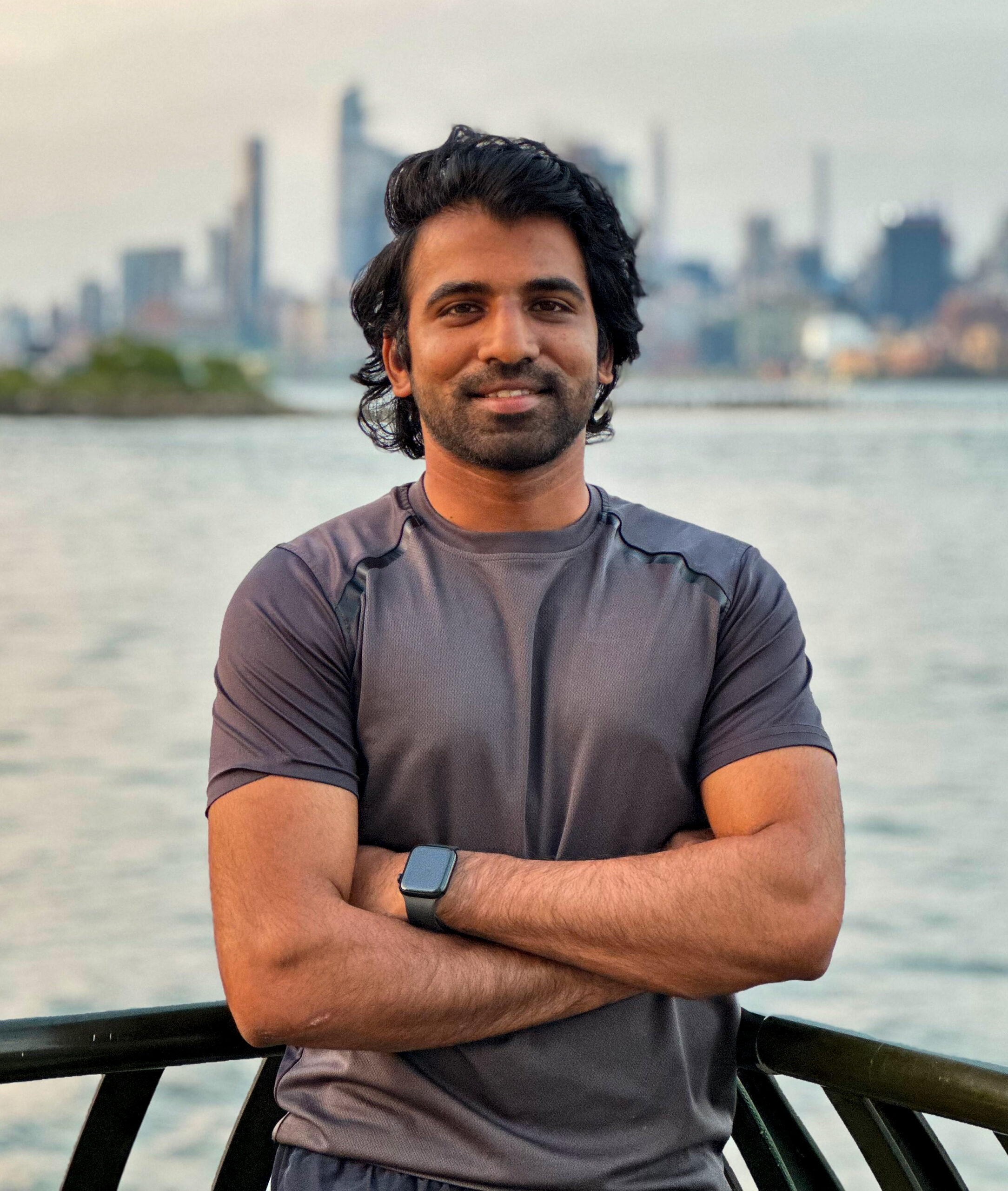 Ajay Surya standing beside a sea in new york